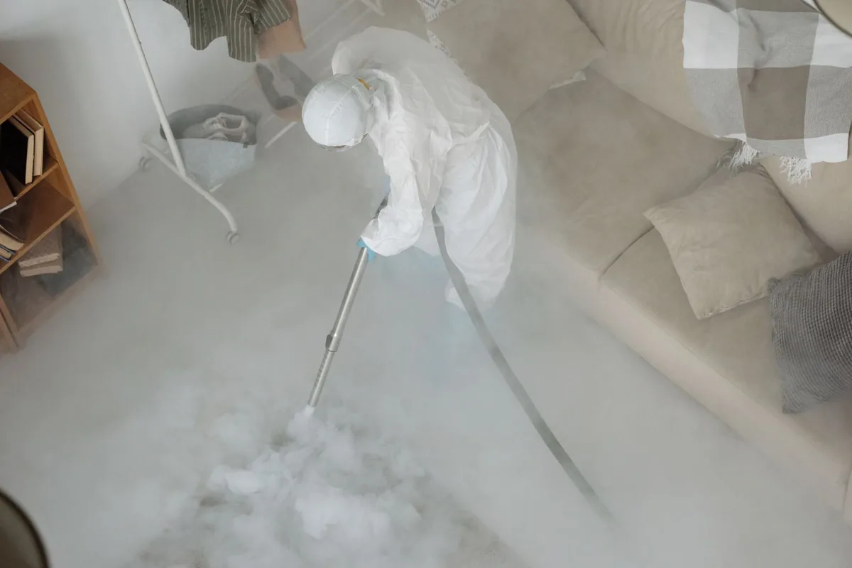 Biohazard cleanup technician in protective equipment, Celebration, FL